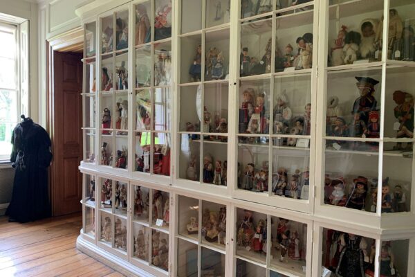The Bird Room, Located At Valentines Mansion. This Image Has A Display Cabinet Filled With Dolls.